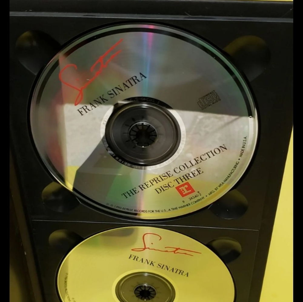 Box set of four Frank Sinatra compact discs plus a book.